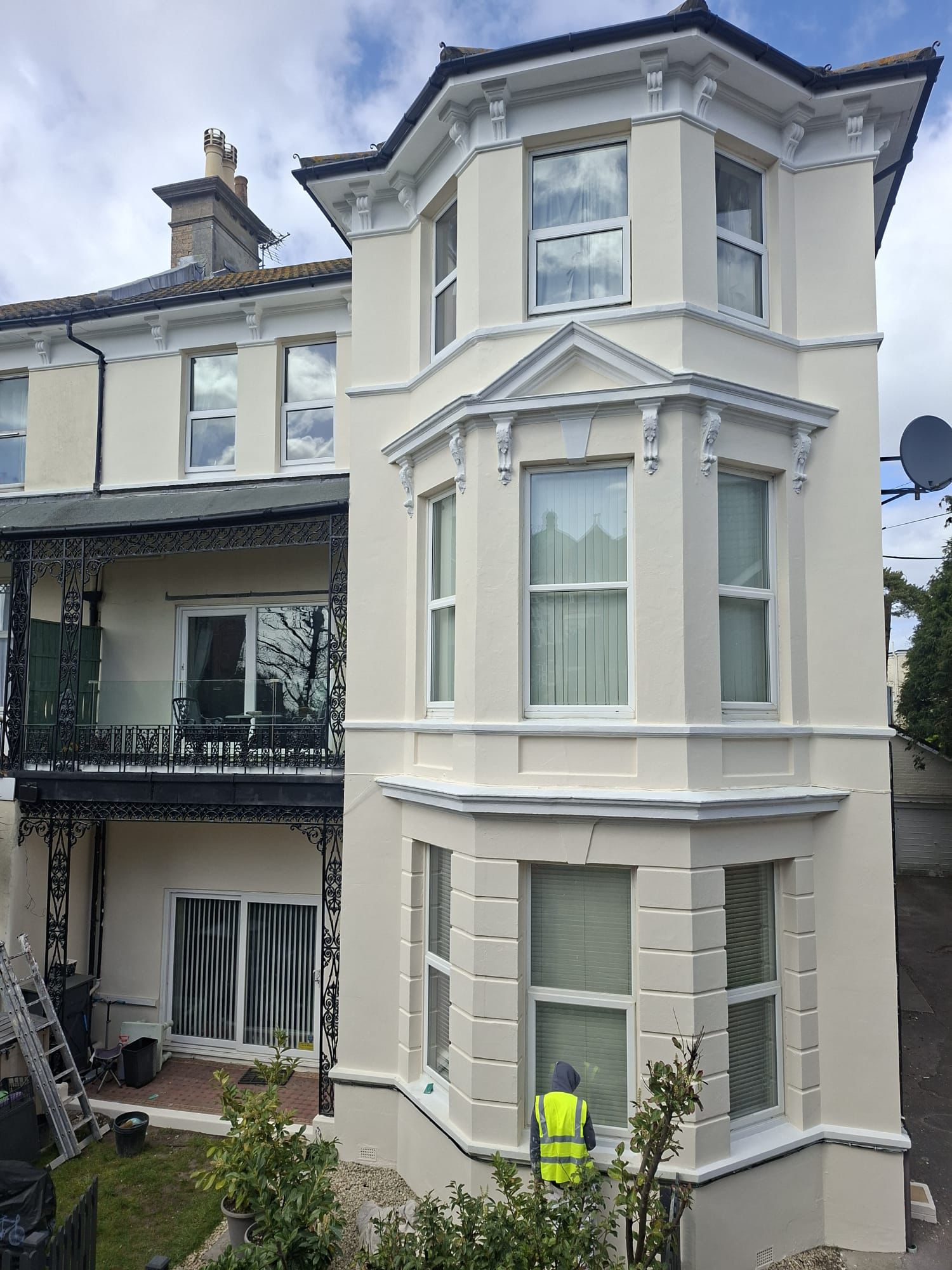 Completed exterior painting on a block of flats in Boscombe with restored masonry, painted bay windows and balcony railings