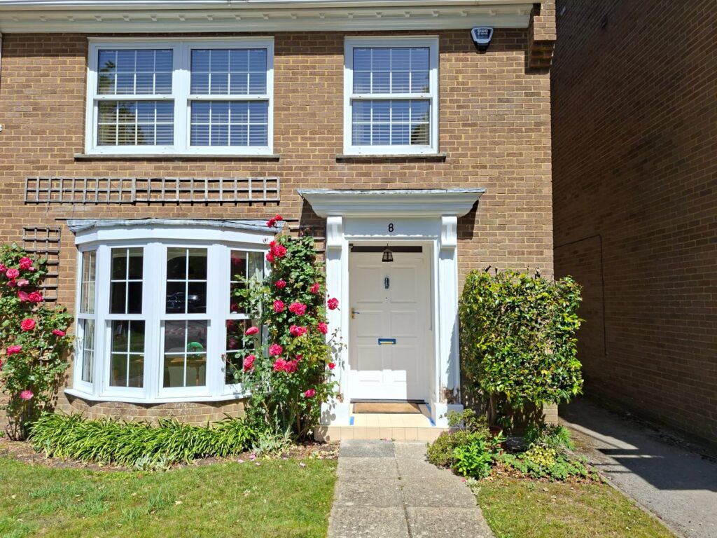Exterior decorating on a terraced home in Bransgore, Hampshire