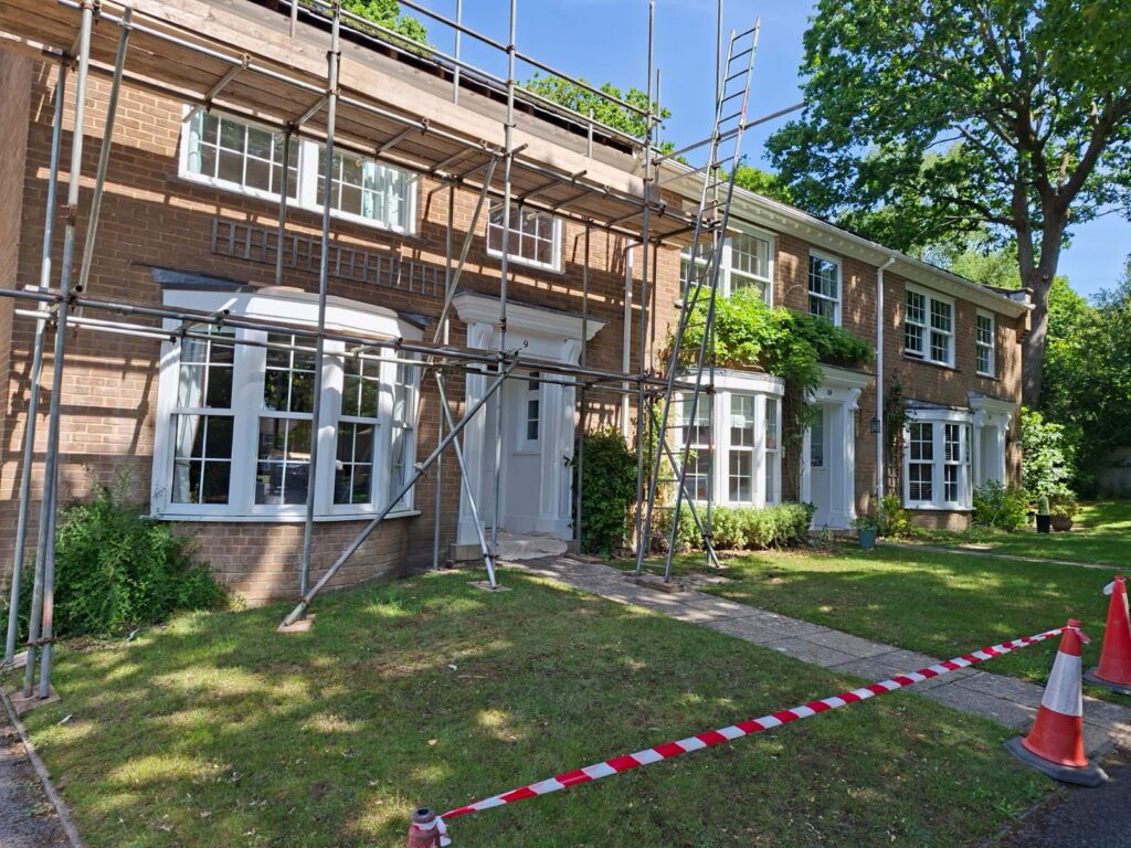 Masonry painting across the Bransgore development